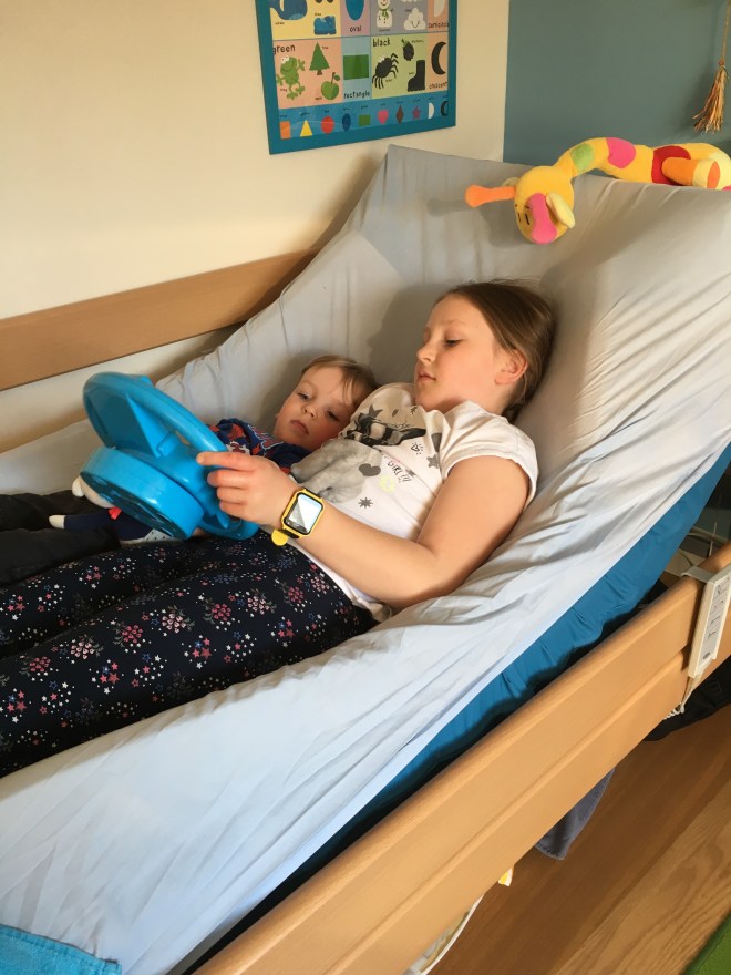 Quinns & Big Sister playing together on the bed (The Cruise Ship)