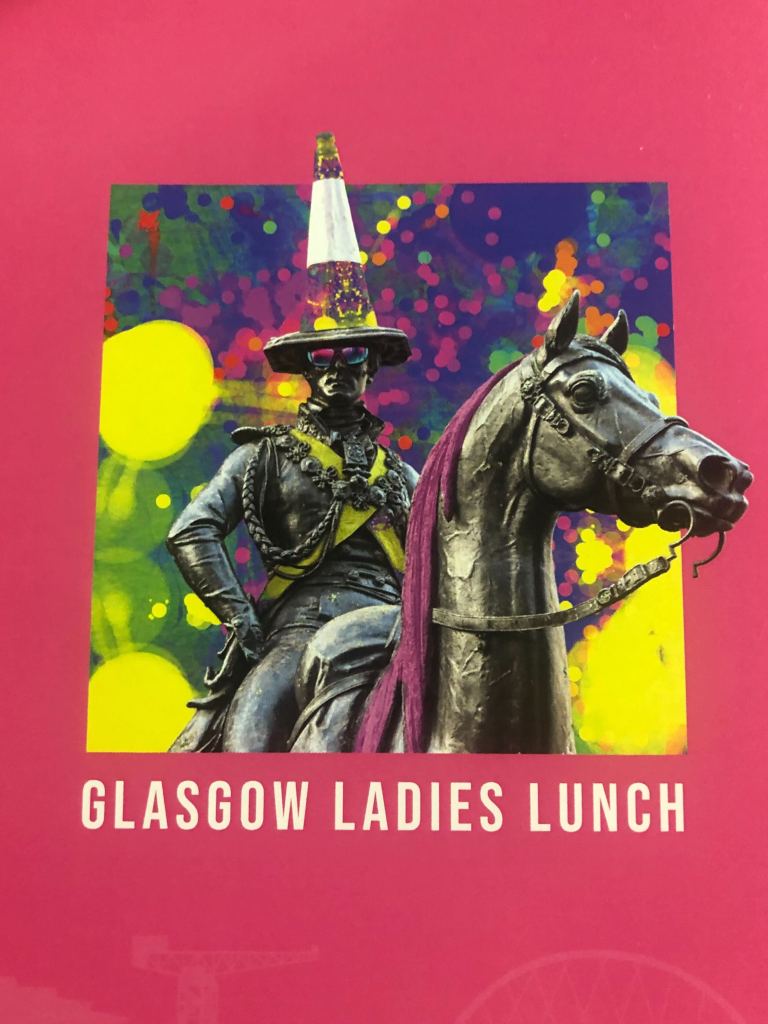 Photo of the famous Glasgwegian statue with the traffic cone with Quinns' artwork as the background