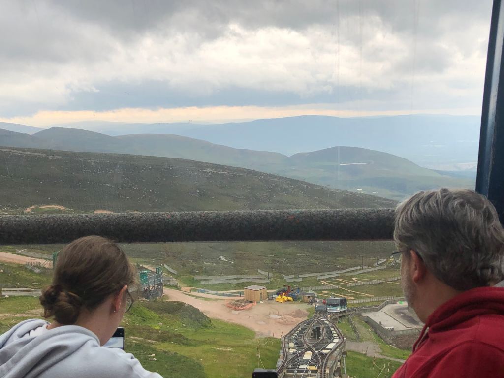 The back of Dad and Anita's heads looking out at the view over Cairngorm as the train descended.